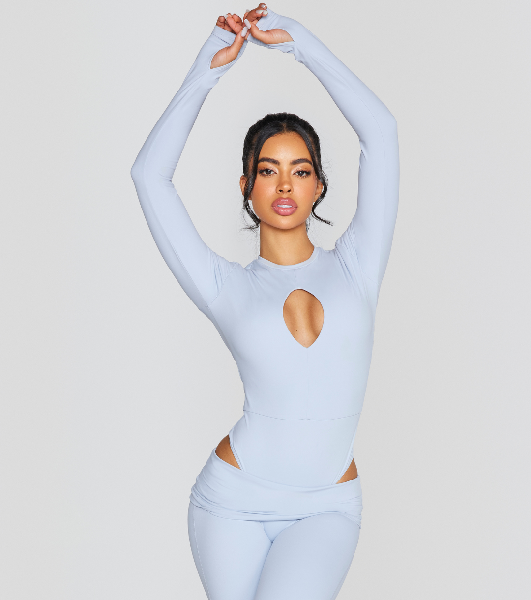 EXPOSED REVERSIBLE LONG SLEEVE BODYSUIT