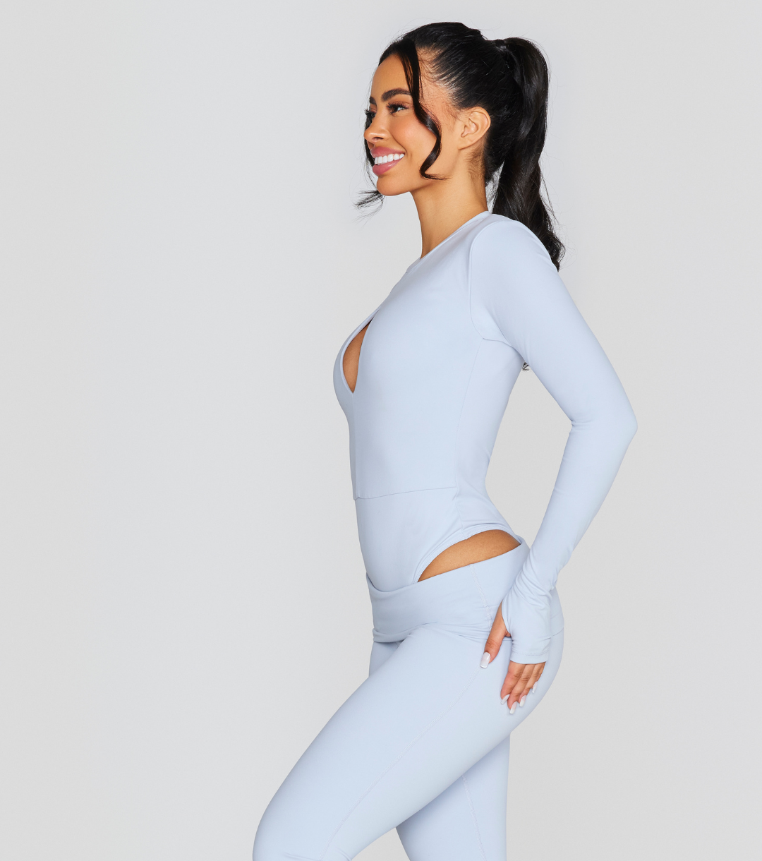 EXPOSED REVERSIBLE LONG SLEEVE BODYSUIT