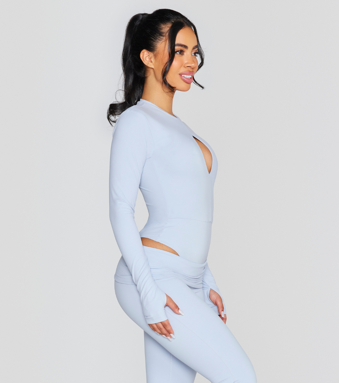 EXPOSED REVERSIBLE LONG SLEEVE BODYSUIT
